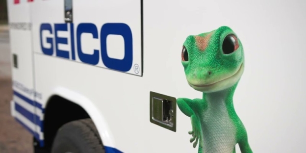 A green lizard standing next to a white vehicle AI-generated content may be incorrect.